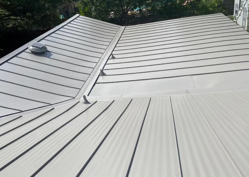Solar attic fan installed on a metal roof for Roof Ventilation in Coolbaugh